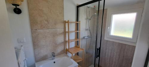 a bathroom with a shower and a sink and a toilet at Renovated house 3 bedrooms, sleeps 9 in Le Palais