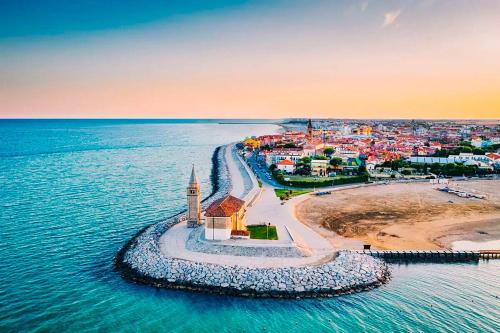 an aerial view of a small island in the water at Caorle Oasis Beach House - Host Solution in Caorle