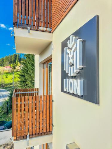 a sign on the side of a building at Lion in Bukovel