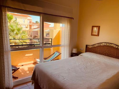 En eller flere senge i et værelse på Apartamento Islantilla Golf