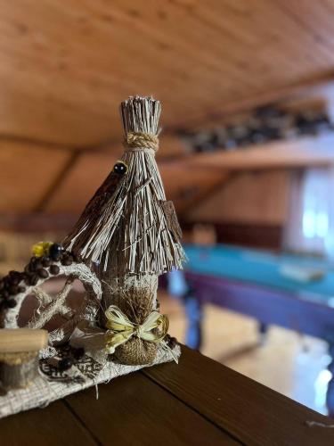 a tied up item with a bow on a table at Карпатська Модрина in Kosiv