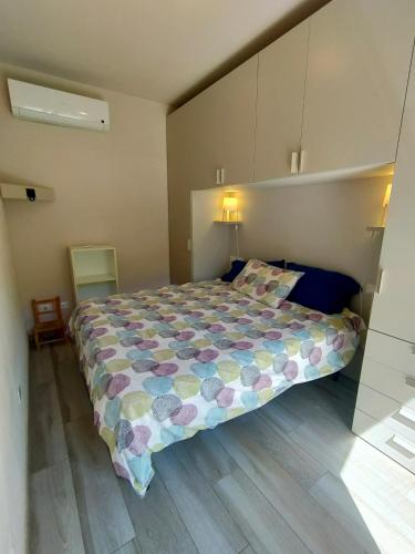 a bedroom with a large bed in a room at Villa dei Cavallucci Marini in Capoliveri