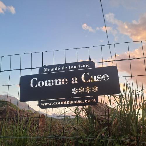 a sign on a fence that reads continue a case at Gîte Coume a Case, Pyrénées Atlantiques in Lys