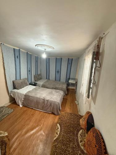 Llit o llits en una habitació de Dar Elkorchi