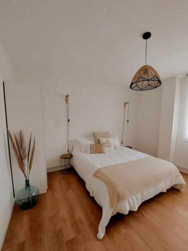 Ένα ή περισσότερα κρεβάτια σε δωμάτιο στο Apartamento Zalo