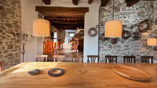 a dining room with a wooden table and chairs at Bio Agriturismo Il Vigno in Caprese Michelangelo