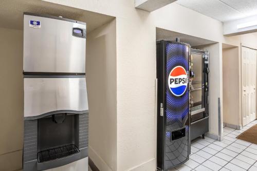 a pepsi machine on a wall in a building at Red Roof Inn Tinton Falls-Jersey Shore in Tinton Falls
