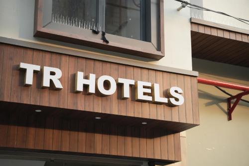 a hotel sign on the side of a building at TR Hotels in Ambāla