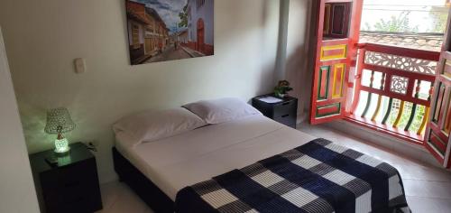 Postel nebo postele na pokoji v ubytování Refugio Sereno en Jericó 1