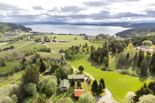 an aerial view of a farm with a lake at Adventure house Katrine in Mosvik
