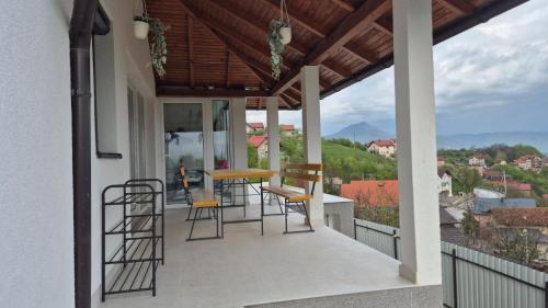 a balcony of a house with chairs and a table at Azur Perla in Sarajevo