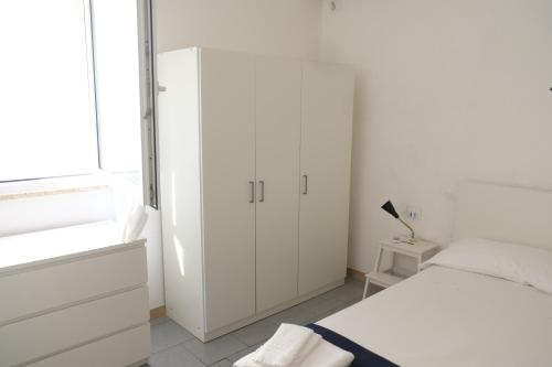 Katil atau katil-katil dalam bilik di Case al mare in Salento - bilocale B7