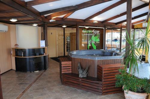 a wellness center with a hot tub in a building at Arapey Oasis Termal Hotel in Termas del Arapey