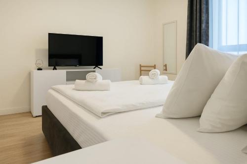 Μια τηλεόραση ή/και κέντρο ψυχαγωγίας στο Queen's Park Residence Apartments