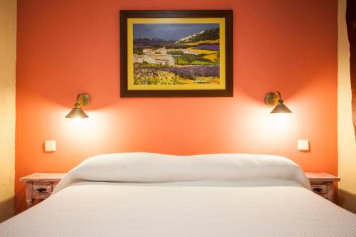 Cama o camas de una habitación en Hostal Castilla