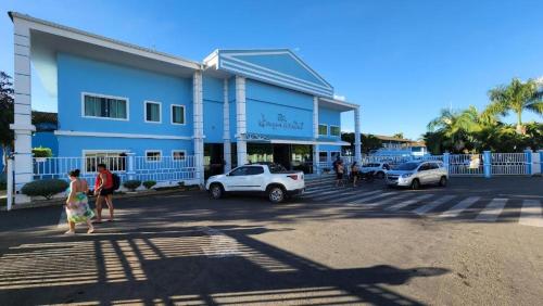 a group of people standing outside of a building at Lacqua diRoma 1 - Apartamentos JN in Caldas Novas