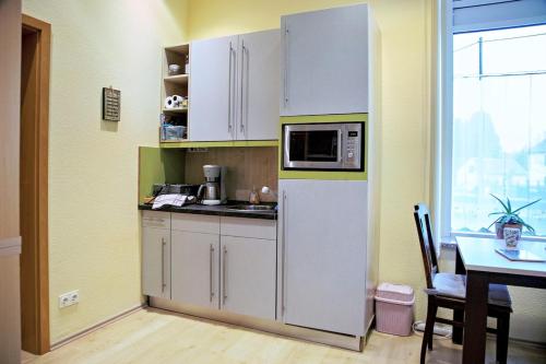 Kuchyň nebo kuchyňský kout v ubytování Ferienwohnung Reinhold