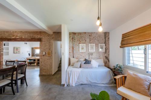 Ένα ή περισσότερα κρεβάτια σε δωμάτιο στο Casas Urbanas Apart Hotel