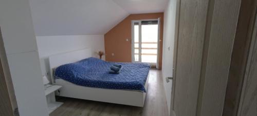 Кровать или кровати в номере Vila Piramida - Zavojsko jezero-Pirot