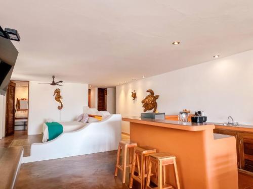 Ένα ή περισσότερα κρεβάτια σε δωμάτιο στο Punta Arena Surf Suites