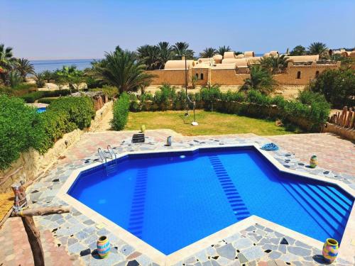 Πισίνα στο ή κοντά στο Tunis village Rural Lakeside Villa, No Mixed Groups