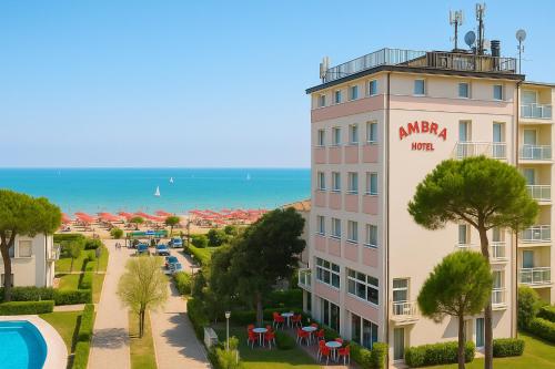 a view of a hotel with a pool and the ocean at HOTEL AMBRA - Fronte Mare - Vicinissimi al Centro in Milano Marittima