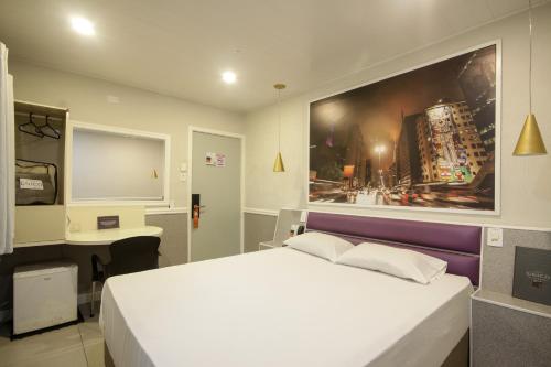 Calamares Hotel São Caetanoにあるベッド