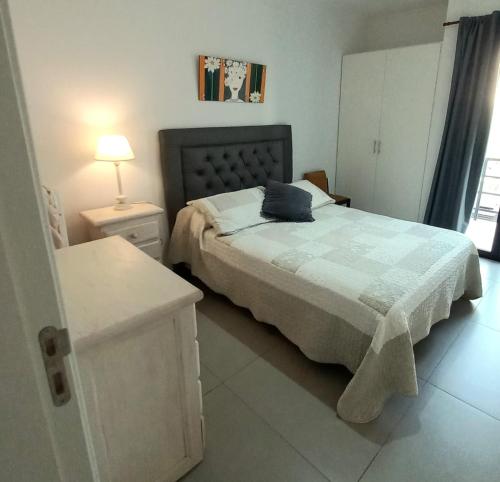 Ένα ή περισσότερα κρεβάτια σε δωμάτιο στο El Trébol II