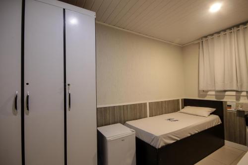 Calamares Hotel São Caetanoにあるベッド