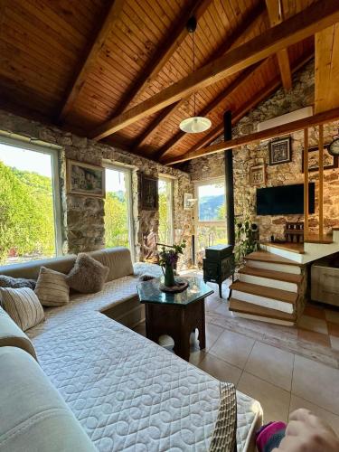 a living room with a couch and a table at Guest House Queen in Konjic
