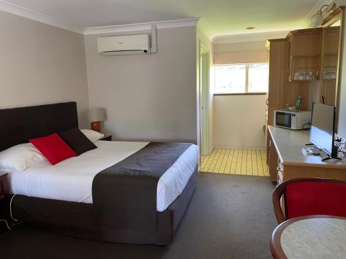 Kuchyň nebo kuchyňský kout v ubytování McNevins Warwick Motel