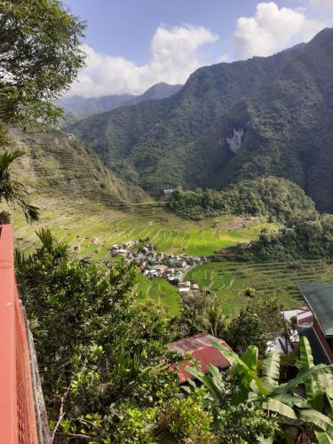 a view of a valley with mountains in the background at Batad Lhorens Inn and Restaurant in Banaue