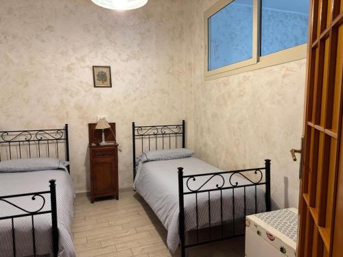 Postel nebo postele na pokoji v ubytování Casa Vacanza Sweet Home