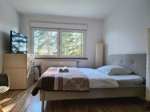 a bedroom with a bed and a window at Melia in Hamm