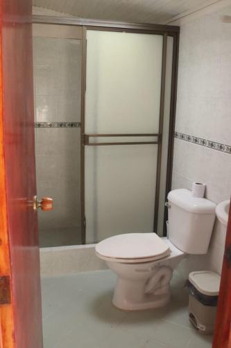 a bathroom with a toilet and a shower at Casa Villetana in Villeta