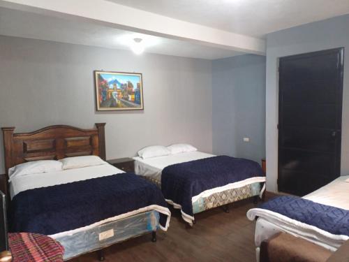 Ένα ή περισσότερα κρεβάτια σε δωμάτιο στο Hotel Posada Belén