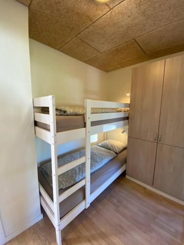 a bunk bed room with two bunk beds in it at Billund Sol Center House in Billund