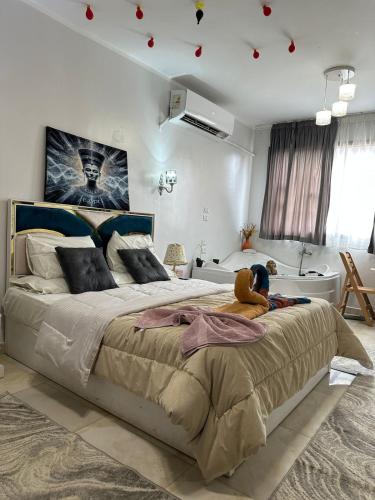 a bedroom with a large bed with a teddy bear on it at Luxury Panorama pyramids & jacuzzi in Cairo