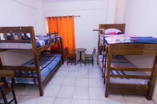 Adventure 360º Hostelにあるベッド