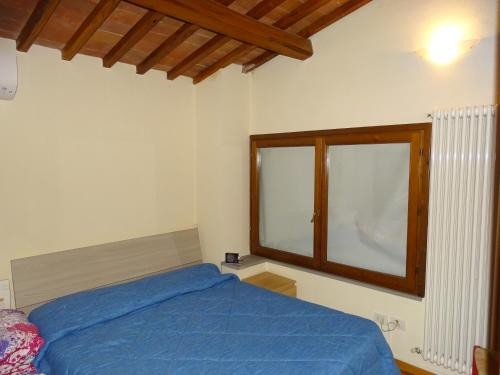 Katil atau katil-katil dalam bilik di Agriturismo Conca Verde