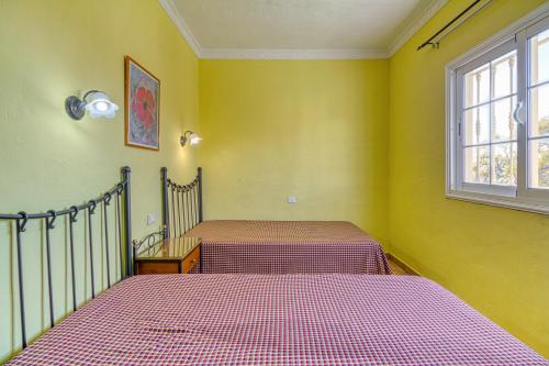Katil atau katil-katil dalam bilik di Apartamentos Todoque
