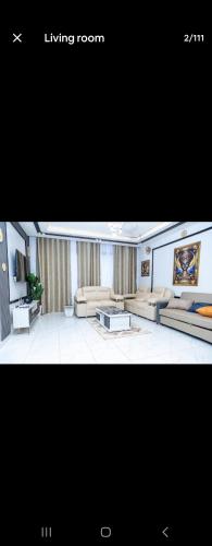 a living room with two couches and a couch at Cozy Luxe 2 Bedroom 2 Bath Apartment with Balcony BBB NATION OASIS KIGALI in Kigali
