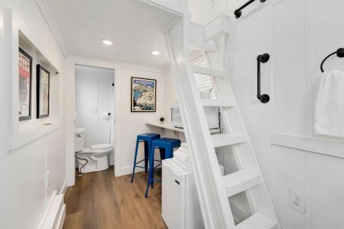 a bathroom with a white staircase and a toilet at Riverside Colorado in Bellvue