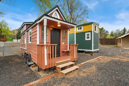 a tiny house is parked in a lot at Riverside Colorado in Bellvue