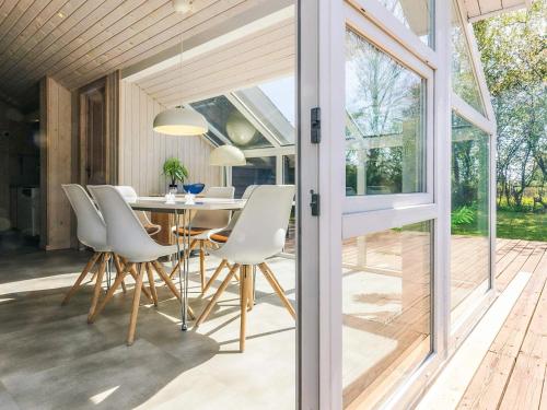 a dining room with a table and chairs at 6 person holiday home in Karrebæksminde-By Traum in Karrebæksminde