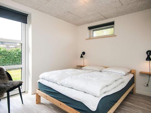 En eller flere senge i et værelse på 4 star holiday home in Børkop