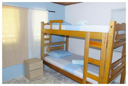 a couple of bunk beds in a room at Casa Bambudas in Rincón