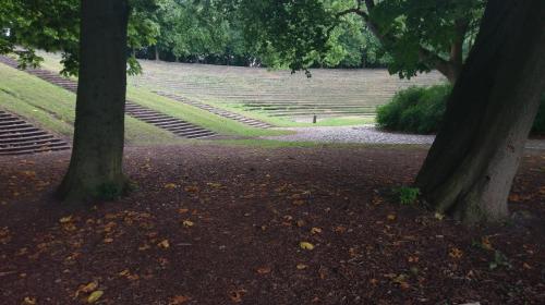 two trees in a park with stairs in the background at Villa Rosa, dobblebed, own kitchen, own bath and own entrance in Copenhagen