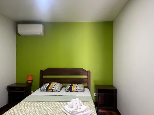 Una cama o camas en una habitación de Gîte des Flamboyants Orion Pk 14