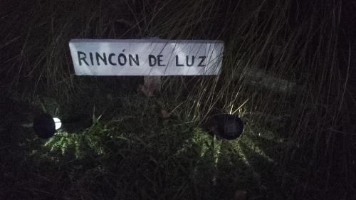 a sign that reads rutherford be lucille in the grass at Rincón de Luz in José Ignacio